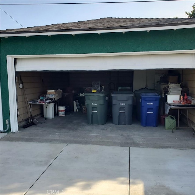 garage featuring driveway