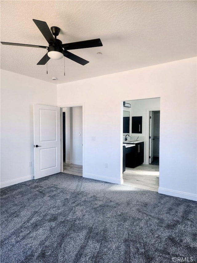 unfurnished room with light colored carpet, ceiling fan, and baseboards