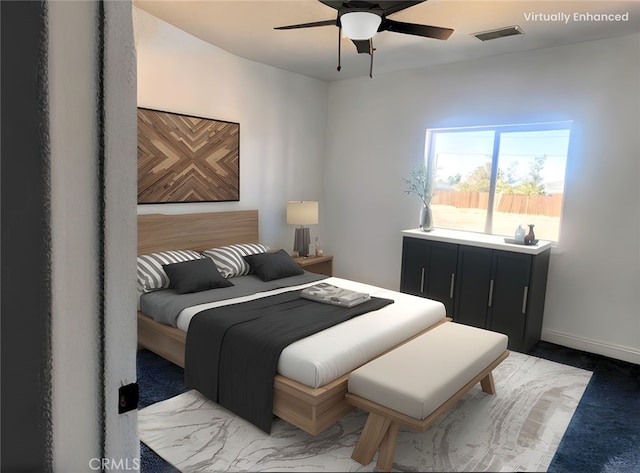 bedroom featuring baseboards, ceiling fan, and visible vents