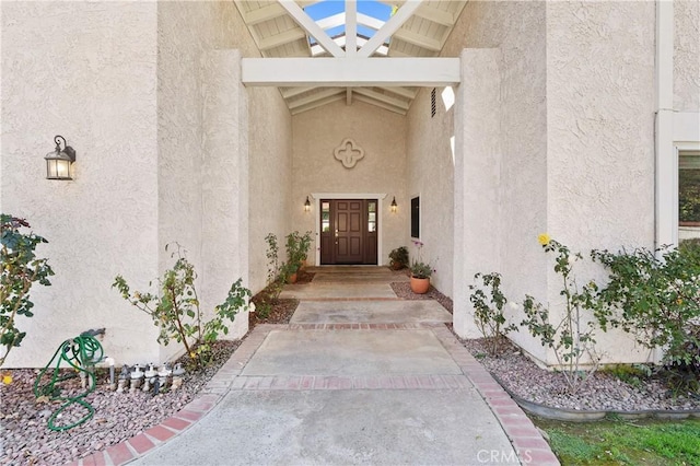 doorway to property with stucco siding