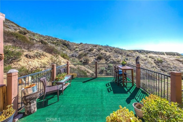 balcony featuring a mountain view