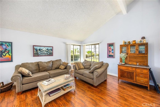 living room featuring baseboards, wood finished floors, beamed ceiling, a textured ceiling, and high vaulted ceiling