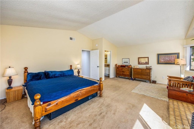 bedroom with lofted ceiling, carpet floors, a textured ceiling, and visible vents