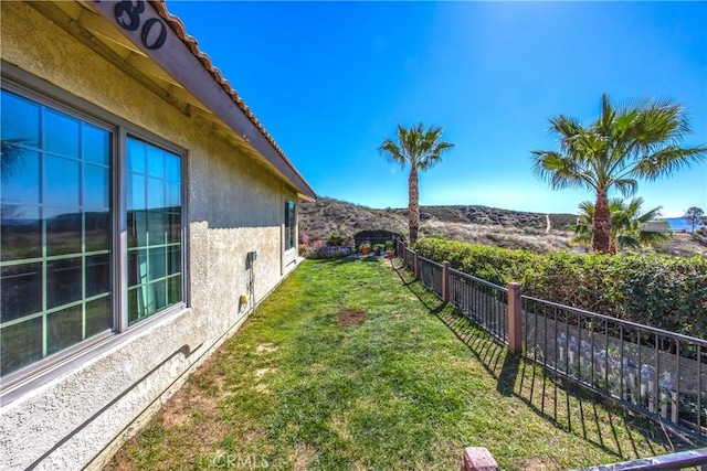 view of yard with fence