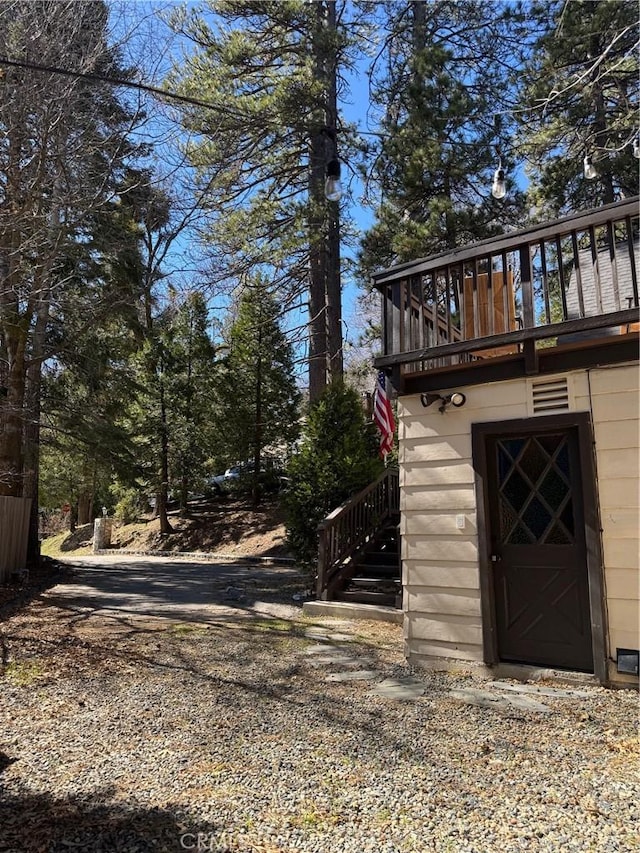 283 Walnut Dr, Lake Arrowhead, CA 92352 - view of yard featuring stairway and a wooden deck