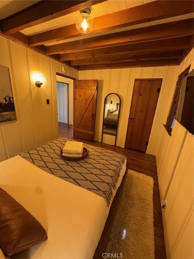 283 Walnut Dr, Lake Arrowhead, CA 92352 - bedroom featuring beam ceiling and a decorative wall