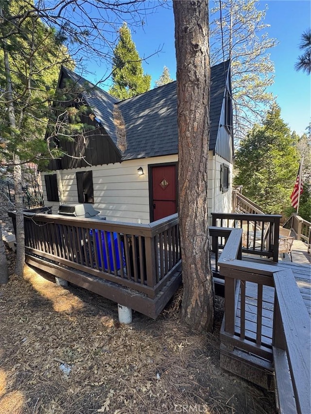 283 Walnut Dr, Lake Arrowhead, CA 92352 - rear view of property with roof with shingles and a deck