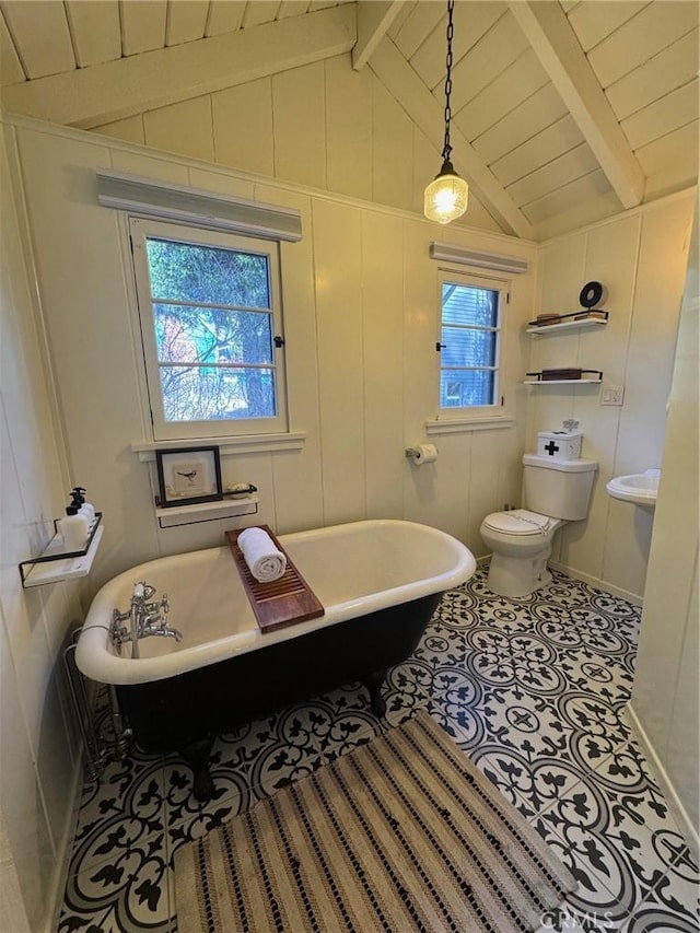 283 Walnut Dr, Lake Arrowhead, CA 92352 - bathroom featuring a soaking tub, tile patterned floors, and toilet