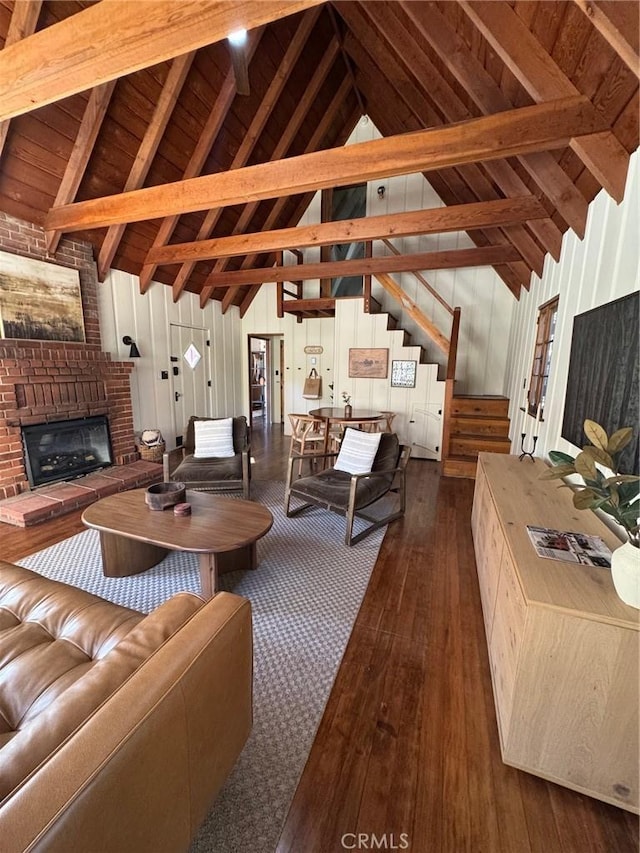 283 Walnut Dr, Lake Arrowhead, CA 92352 - living room featuring dark wood-type flooring, a fireplace, high vaulted ceiling, wooden ceiling with exposed beams, and wooden walls