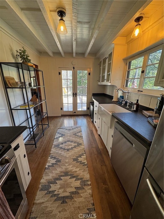 283 Walnut Dr, Lake Arrowhead, CA 92352 - kitchen featuring french doors, range, dark countertops, stainless steel dishwasher, and white cabinetry