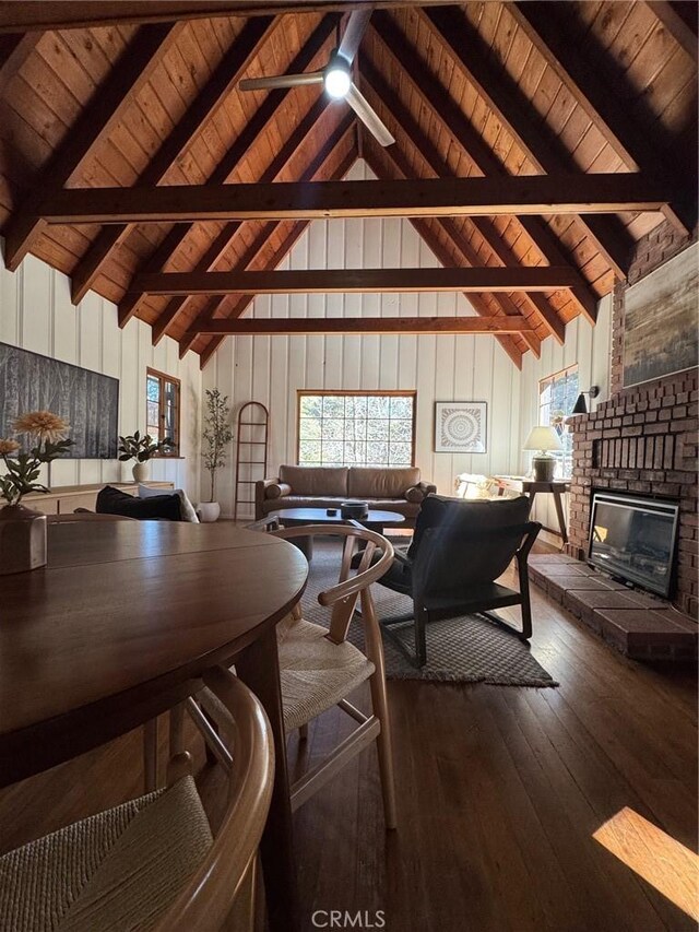 283 Walnut Dr, Lake Arrowhead, CA 92352 - living room featuring high vaulted ceiling, dark wood-style floors, wooden ceiling with exposed beams, a fireplace, and ceiling fan