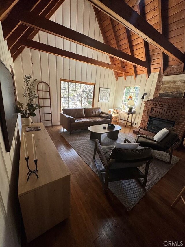 283 Walnut Dr, Lake Arrowhead, CA 92352 - living room featuring wood-type flooring, a fireplace, high vaulted ceiling, beamed ceiling, and wood walls