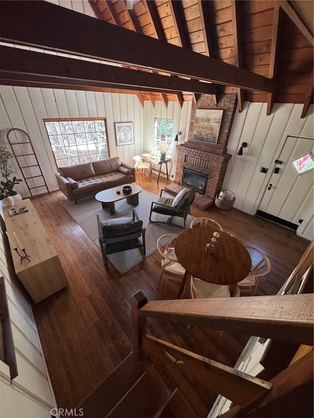 283 Walnut Dr, Lake Arrowhead, CA 92352 - living area with wood finished floors, a fireplace, and wooden walls