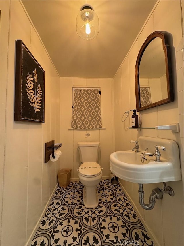 283 Walnut Dr, Lake Arrowhead, CA 92352 - bathroom with toilet, tile patterned floors, and a sink