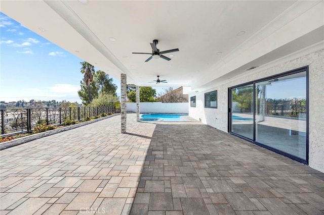 view of swimming pool featuring ceiling fan, a patio area, a fenced backyard, and a fenced in pool