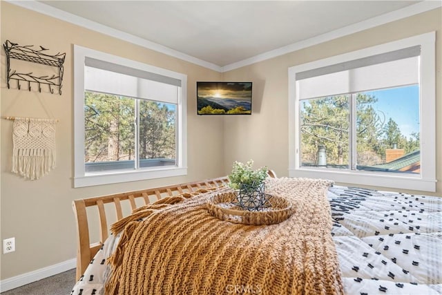 carpeted bedroom with baseboards, multiple windows, and ornamental molding