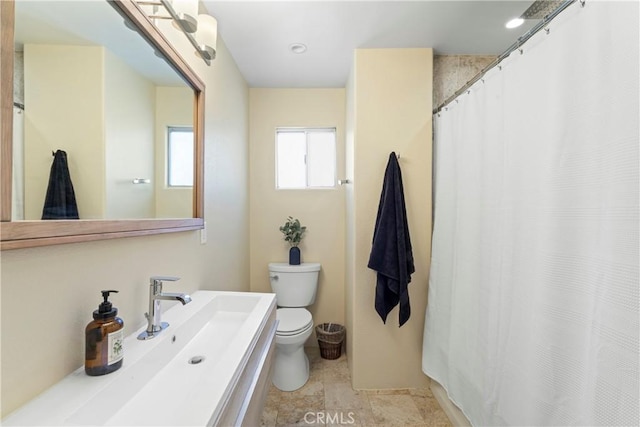 bathroom featuring a sink and toilet