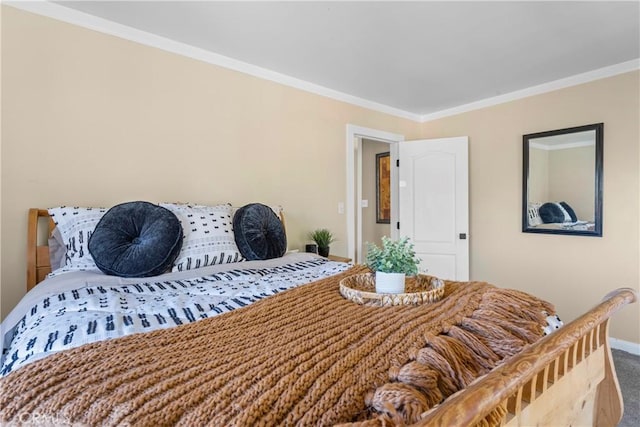 carpeted bedroom with crown molding and baseboards