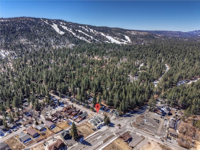 aerial view featuring a mountain view and a forest view