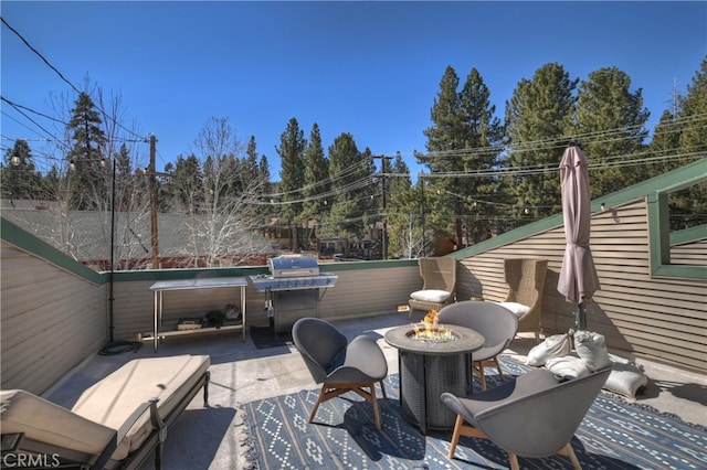 view of patio featuring an outdoor fire pit