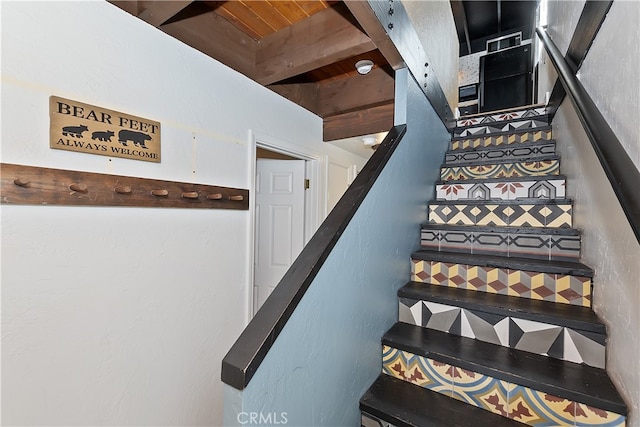 staircase with beam ceiling