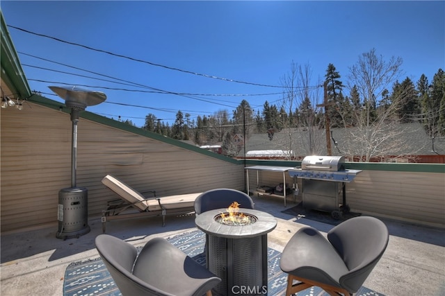 view of patio / terrace featuring a fire pit and grilling area