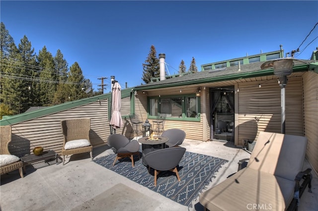 exterior space with a patio area and a fire pit