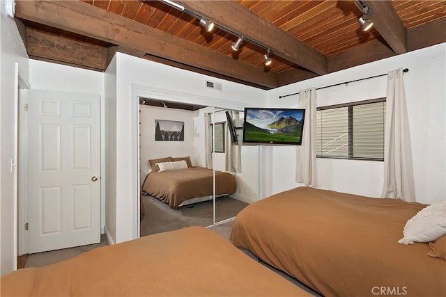 bedroom featuring a closet, wood ceiling, beam ceiling, and visible vents