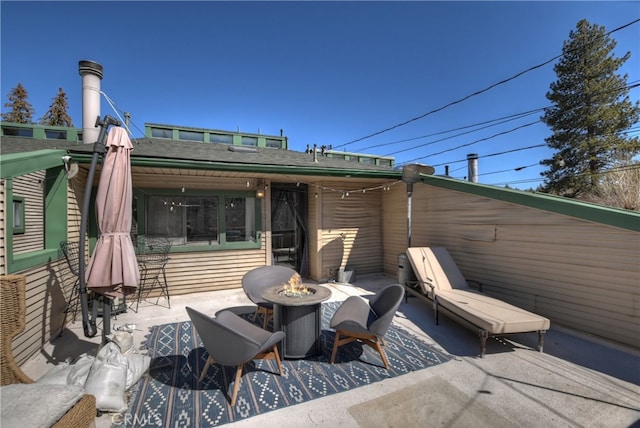 view of patio featuring a fire pit