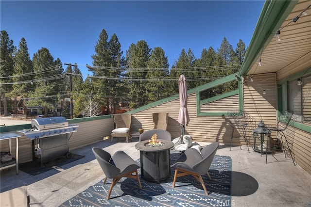 view of patio with a fire pit