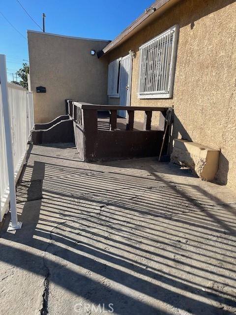 view of home's exterior featuring fence and stucco siding