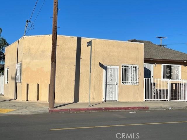 view of building exterior with fence