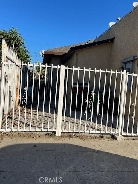 view of gate featuring fence