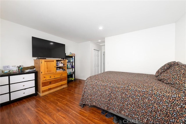 bedroom with dark wood-style floors and recessed lighting