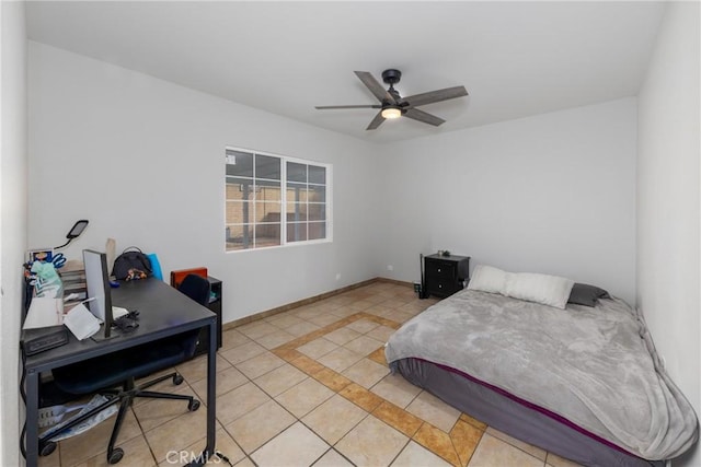 bedroom featuring light tile patterned floors, ceiling fan, and baseboards