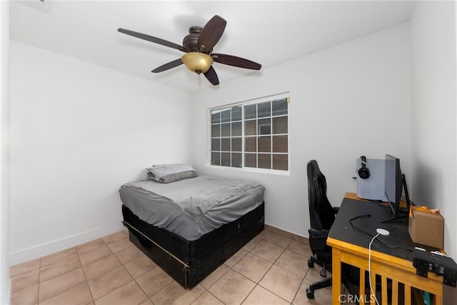 bedroom featuring tile patterned flooring, baseboards, and a ceiling fan