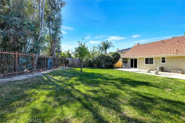 view of yard featuring a patio area and a fenced backyard