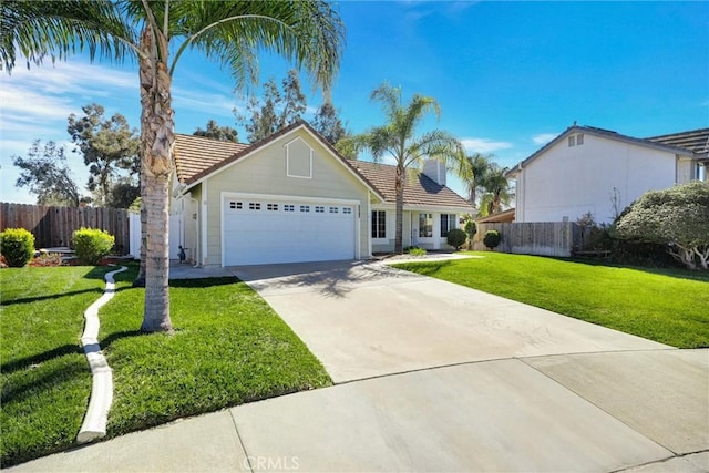 view of front of property with a front lawn, a tile roof, fence, and an attached garage