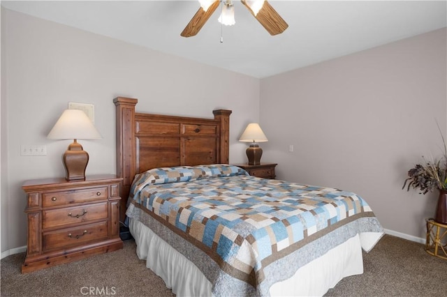 carpeted bedroom featuring baseboards and ceiling fan