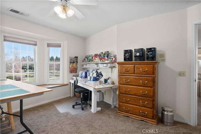 carpeted office featuring visible vents, baseboards, a ceiling fan, and vaulted ceiling