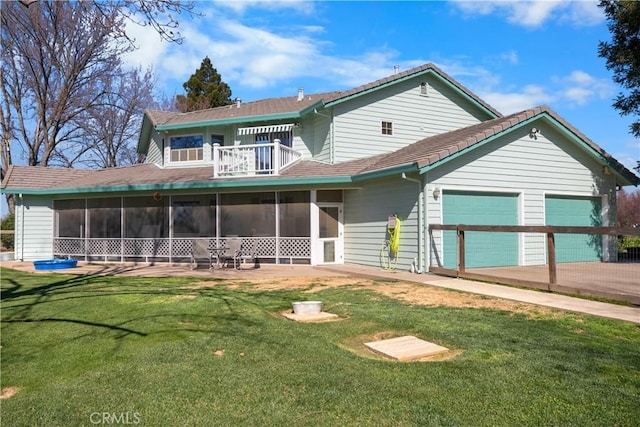 view of front facade with a front lawn, a balcony, driveway, and a sunroom