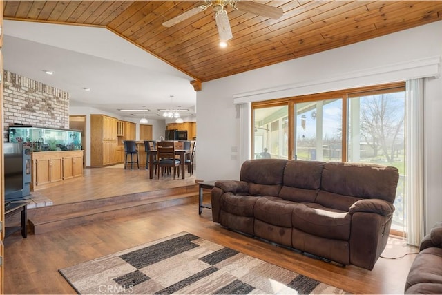 living room with light wood finished floors, wooden ceiling, a ceiling fan, and lofted ceiling