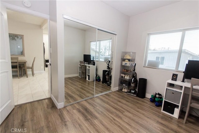 office space with wood finished floors and baseboards