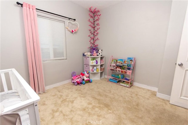 recreation room featuring carpet and baseboards