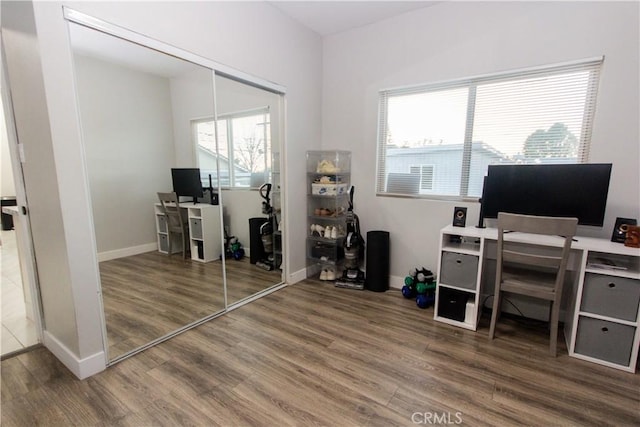 office with wood finished floors and baseboards