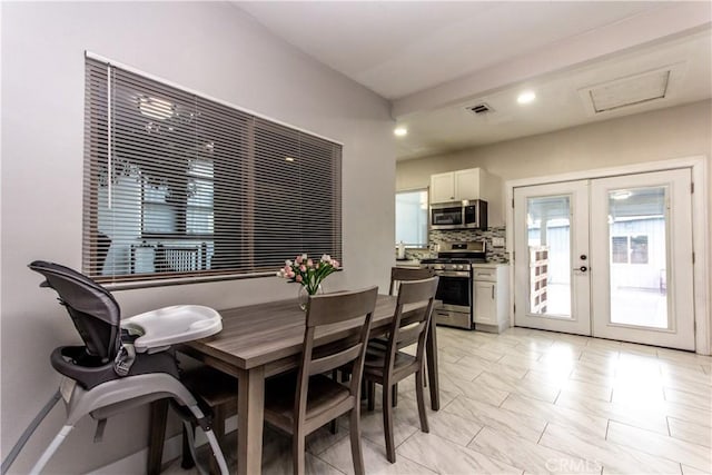 dining room featuring recessed lighting, visible vents, and french doors