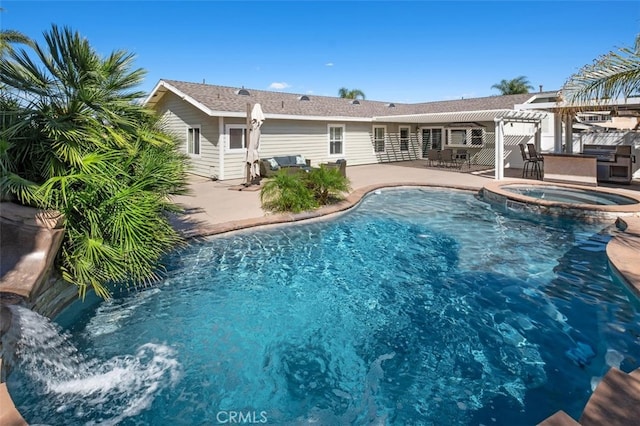 view of pool with a patio area, a pool with connected hot tub, and a pergola