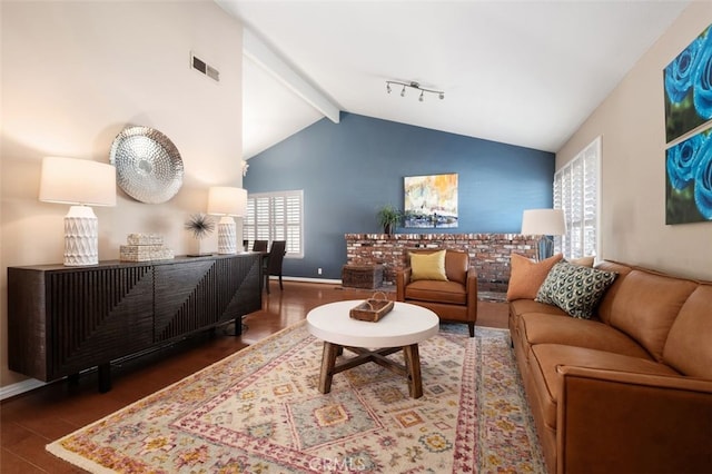 living room featuring baseboards, visible vents, beamed ceiling, wood finished floors, and high vaulted ceiling