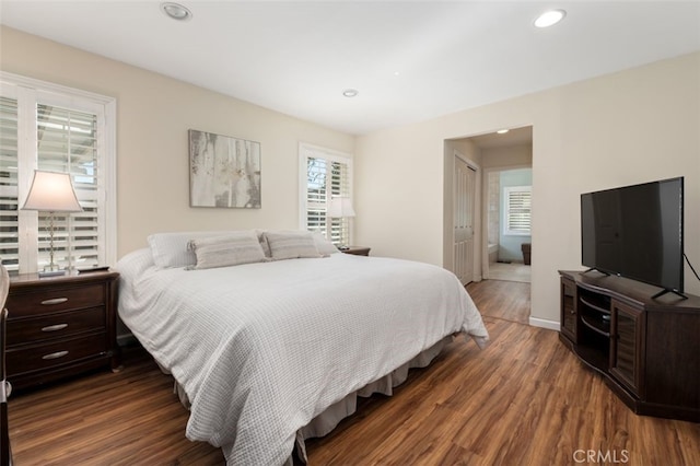 bedroom featuring recessed lighting, a closet, baseboards, and wood finished floors