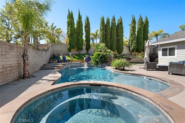 view of pool featuring a fenced in pool, a patio, an in ground hot tub, a water slide, and a fenced backyard